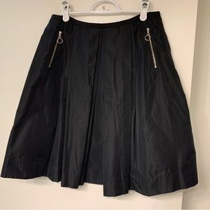 Pink Tartan black a-line skirt w/silver zipper pockets, gold/silver back zipper.